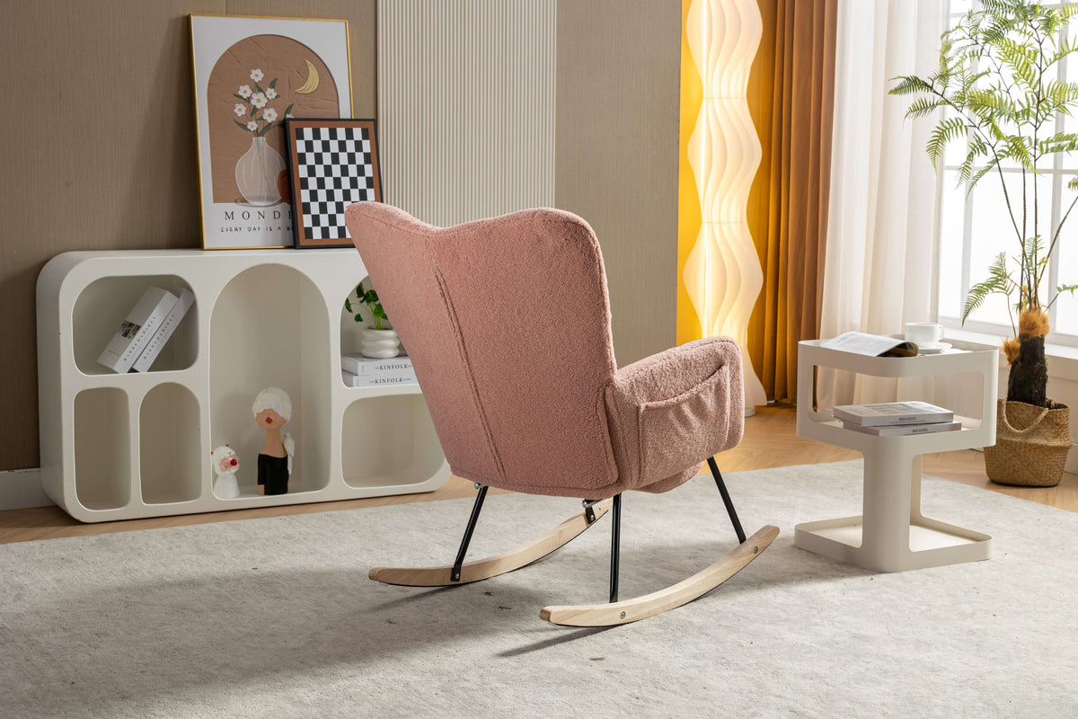 pink teddy rocking chair with footstool in a cozy living room setting with decorative accents.