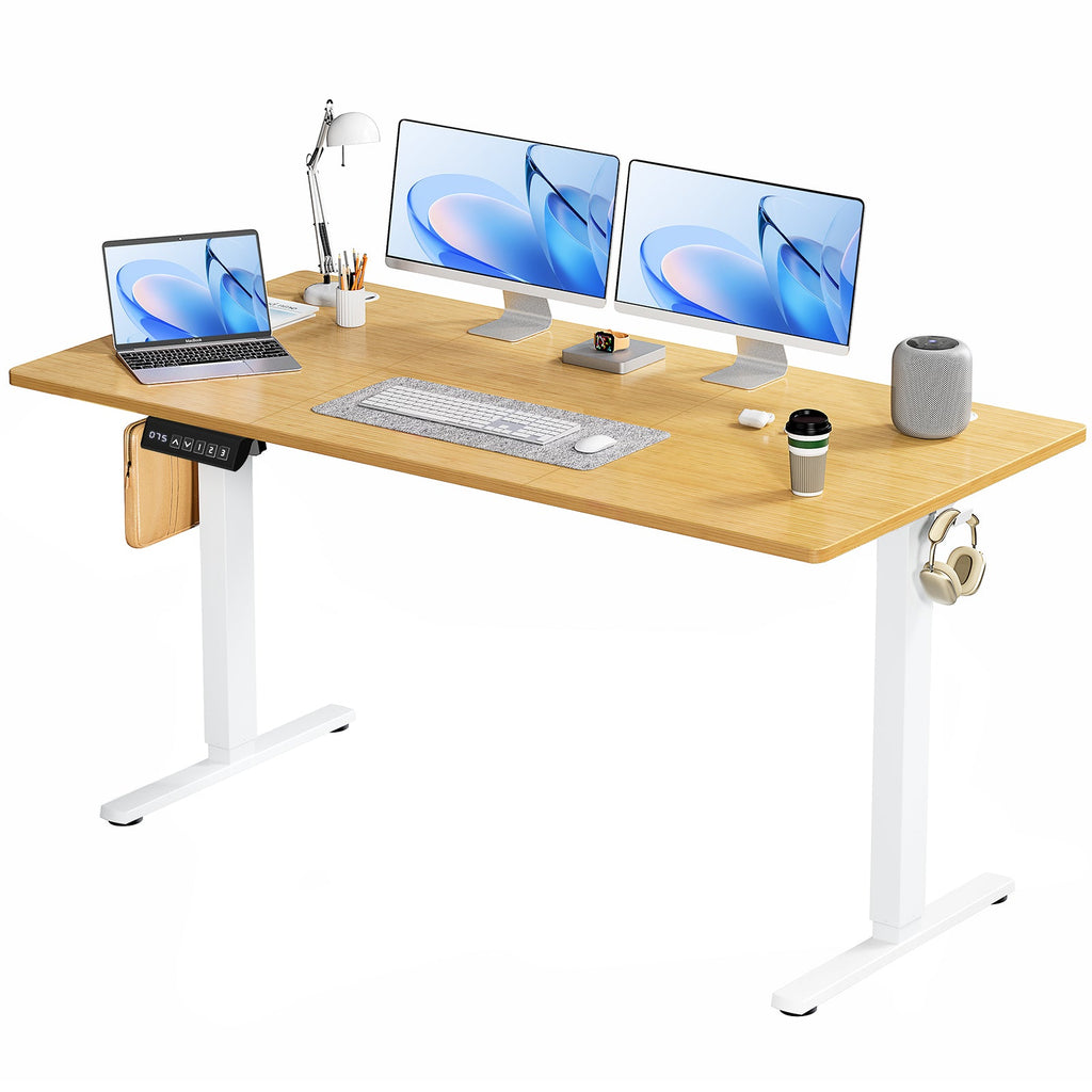 Electric standing desk raised to standing height in home office